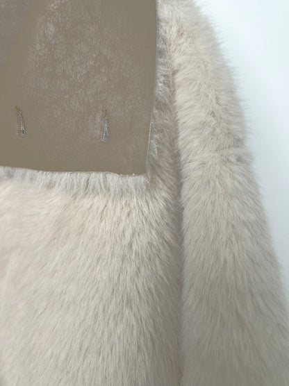 MANTEAU COURT A FAUSSE FOURRURE RÉVERSIBLE